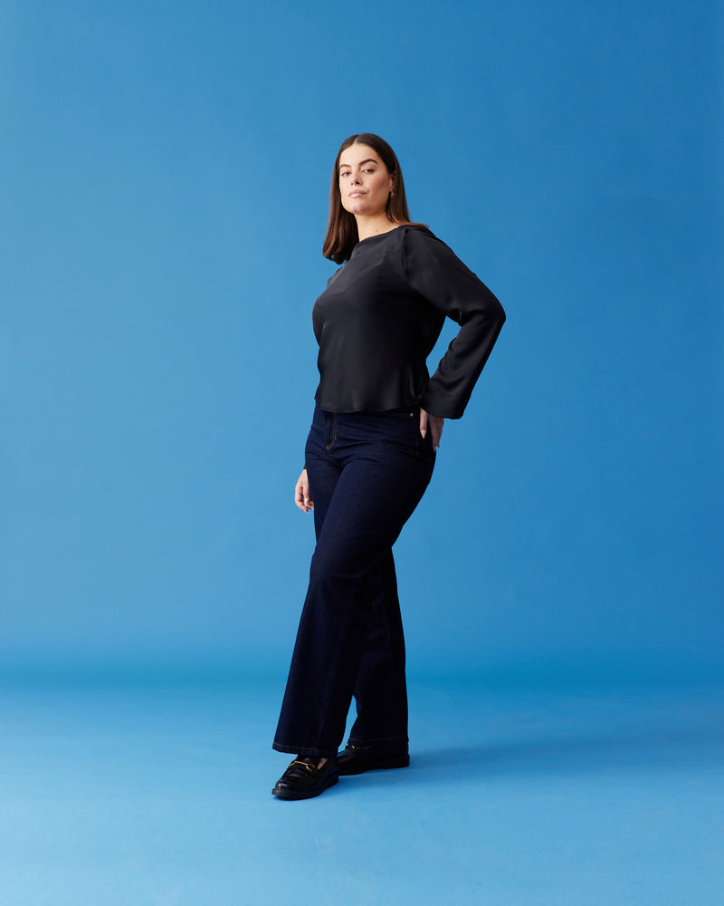 FIREBIRD SATIN COWL TOP BLACK | Longsleeve blouse with a cowl neck scoop back, crafted in lush black satin, an update on the much loved Firebird Cowl Top. A minimal silhouette with an unexpected detail in...