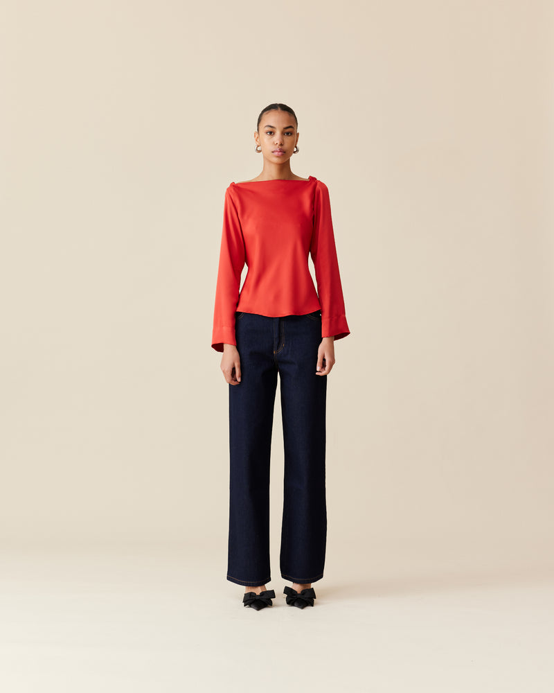 FIREBIRD SATIN COWL TOP CHILLI | Longsleeve blouse with a cowl neck scoop back, crafted in luxe chilli coloured satin. A minimal silhouette with an unexpected detail in the draped back neck and a tie to...