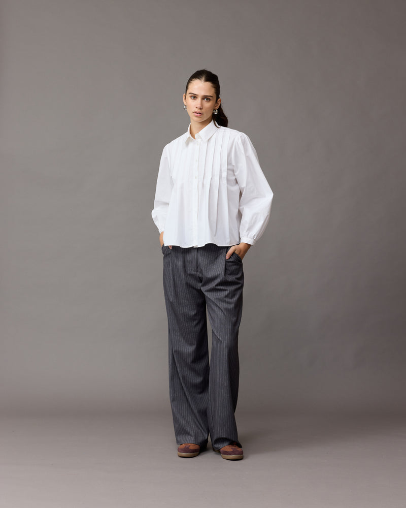 NAOMI SHIRT WHITE | A classic white shirt that is elevated by the front box pleats. This shirt also features a 'balloon' sleeve, that looks great layered under vests and our Margie Tie-Back Top.