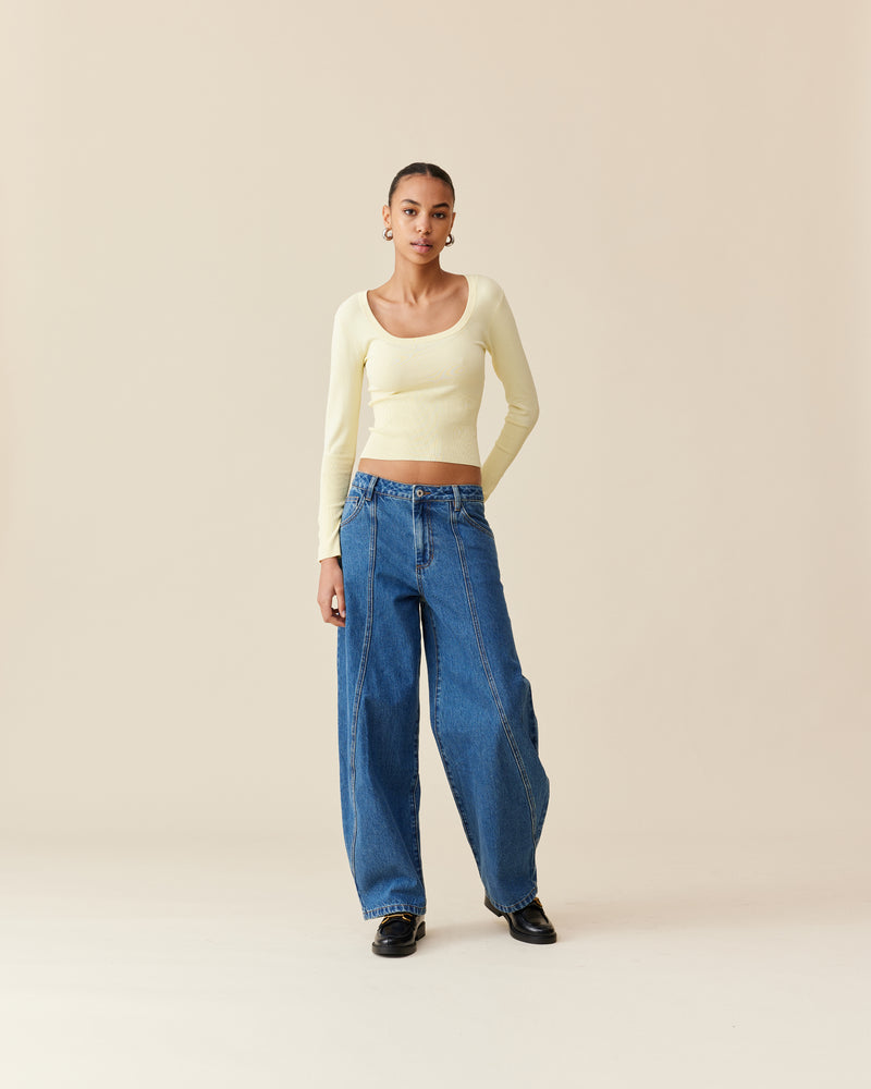 ANNA KNIT TOP BUTTER | Scoop neck long sleeve top designed in a soft butter viscose knit. Features rib detailing under the bust that carries through to the hem. An easy winter basic that will...