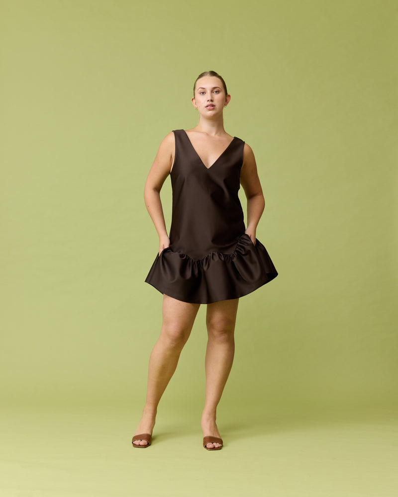 SAKURA COCKTAIL DRESS JAVA | V-neck boxy fit mini dress with a low crossover back and ruffle hemline. Designed in a luxe heavy-weight satin, say hello to your new dream mini dress.