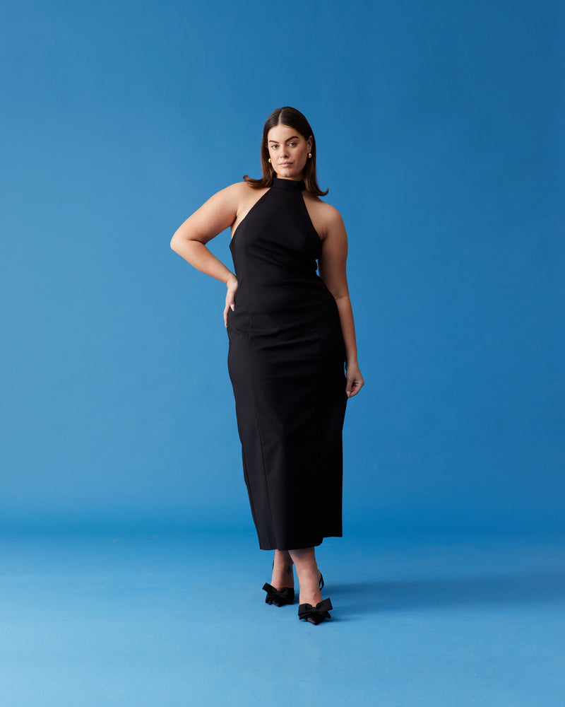 NAOMI HALTER DRESS BLACK | Halter midi dress designed in a mid-weight bengaline fabric with stretch. With an open back and panel detailing through the body, this dress is both elegant and fresh in its...