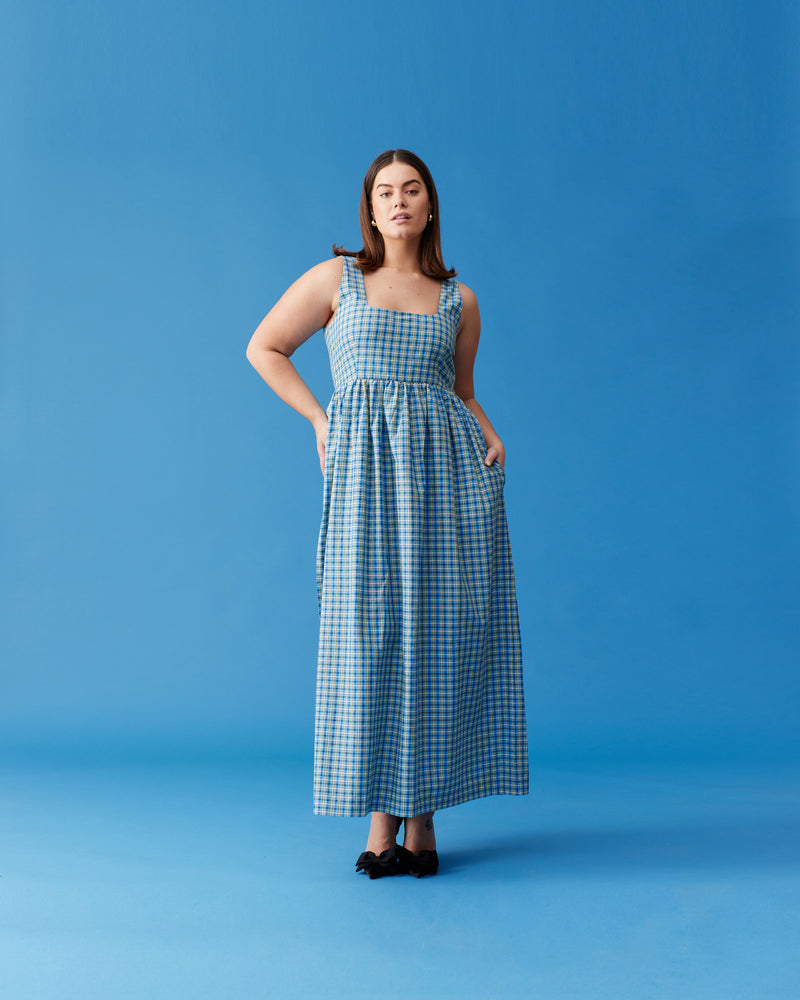 TULIP MAXI DRESS BLUE YELLOW CHECK | Tank-style maxi dress designed in blue and yellow checked cotton. This dress falls to a floaty A-line maxi skirt, and has pockets for all your essentials.
