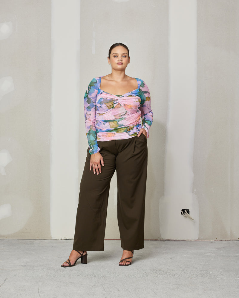 RUE TROUSER KHAKI | Straight leg mid-waist suit trouser with a flat waistband and belt loops. These pants are versatile in that they can we be worn casual with a baby tee, or formal...