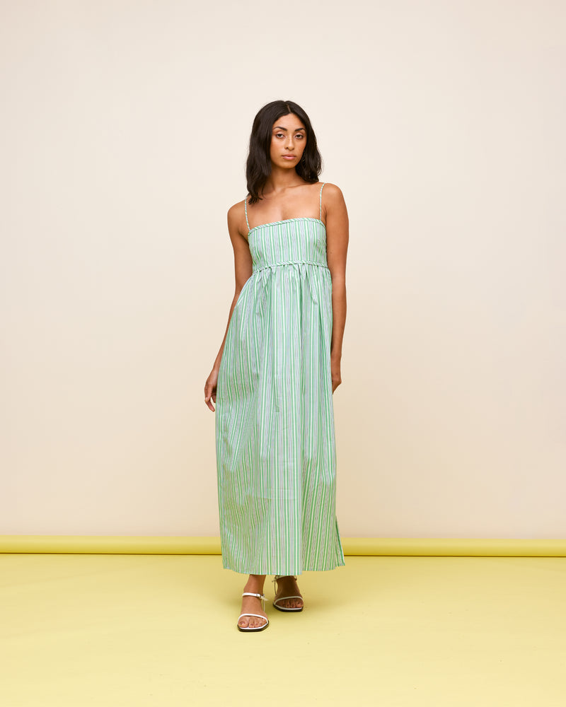 SPRITZ SUNDRESS GREEN STRIPE | Bandeau sundress cut in a green striped cotton, featuring a shirred back, straight neckline and pockets for your essentials. This piece is softly gathered under the bust and falls into...