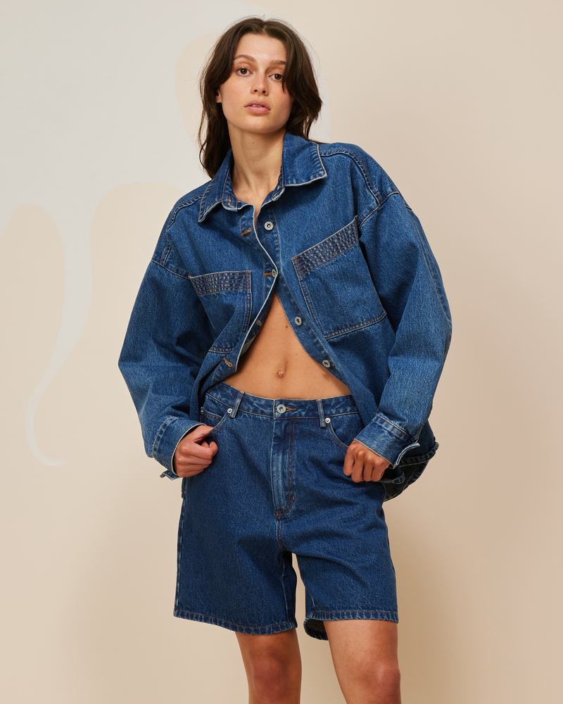 BLINK DENIM SHORT INDIGO | Vintage inspired low waisted short designed in an indigo mid-weight cotton denim. Sitting slightly A-line, this piece offers a longer length & relaxed fit.