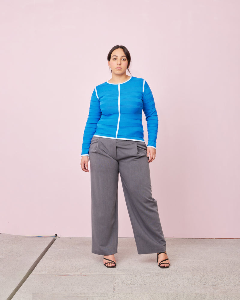 RUE TROUSER CHARCOAL | Straight leg mid-waist suit trouser with a flat waistband and belt loops. These pants are versatile in that they can we be worn casual with a baby tee, or formal with...