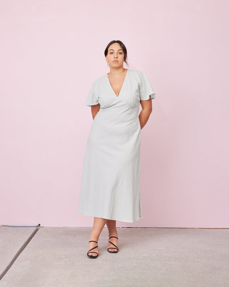 HONEY MIDI DRESS SAGE GINGHAM | 
V-neck midi dress, made in a lightweight cotton gingham. Fitted around the waist flowing to an A-line skirt, this dress is a timeless piece.
 






