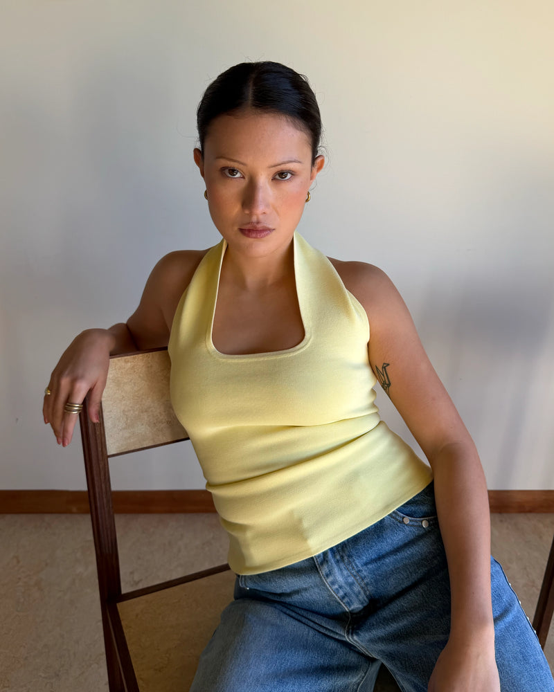 RUDI TANK BUTTER | A twist on the classic halter tank with an oversized strap designed to sit gathered around the neckline, crafted in a mid-weight butter knit. This tank is designed to be worn tight and hold you in when worn. Pair with...