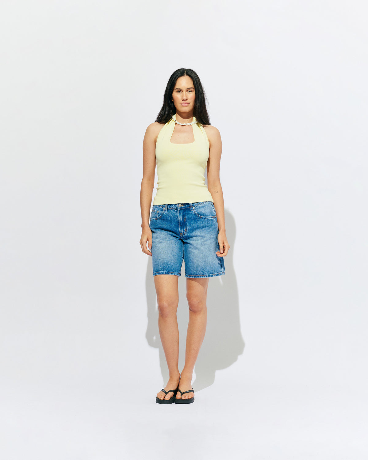 RUDI TANK BUTTER | A twist on the classic halter tank with an oversized strap designed to sit gathered around the neckline, crafted in a mid-weight butter knit. This tank is designed to be worn tight and hold you in when worn. Pair with...