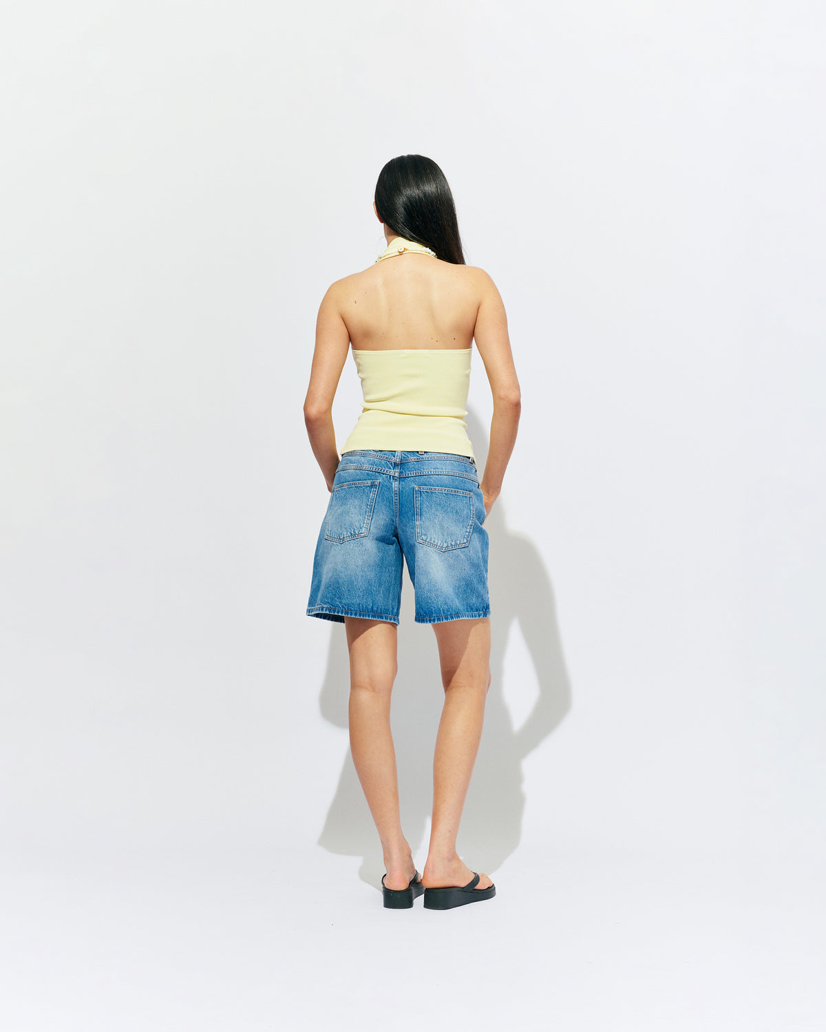RUDI TANK BUTTER | A twist on the classic halter tank with an oversized strap designed to sit gathered around the neckline, crafted in a mid-weight butter knit. This tank is designed to be worn tight and hold you in when worn. Pair with...