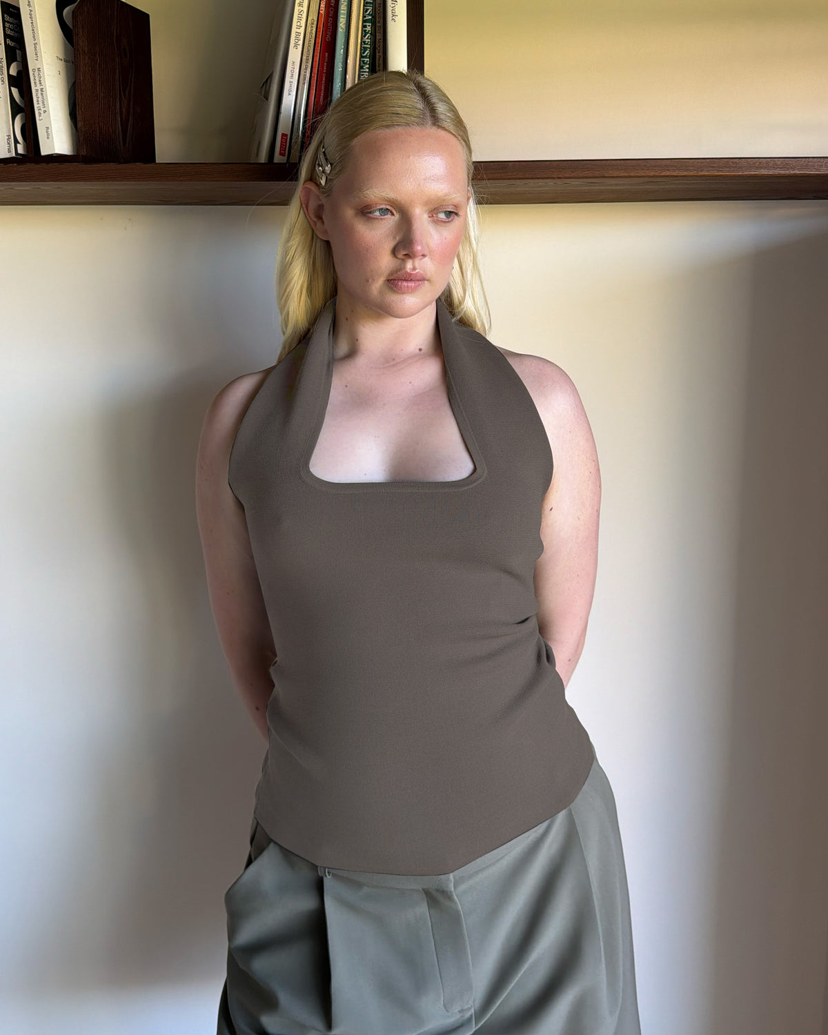 RUDI TANK STONE | A twist on the classic halter tank with an oversized strap designed to sit gathered around the neckline, crafted in a mid-weight stone knit. This tank is designed to be worn tight and hold you in when worn. Pair with...