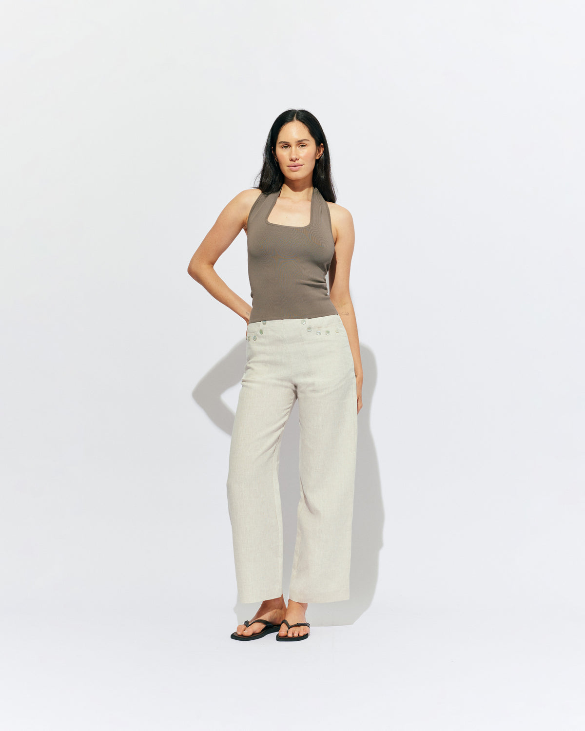 RUDI TANK STONE | A twist on the classic halter tank with an oversized strap designed to sit gathered around the neckline, crafted in a mid-weight stone knit. This tank is designed to be worn tight and hold you in when worn. Pair with...