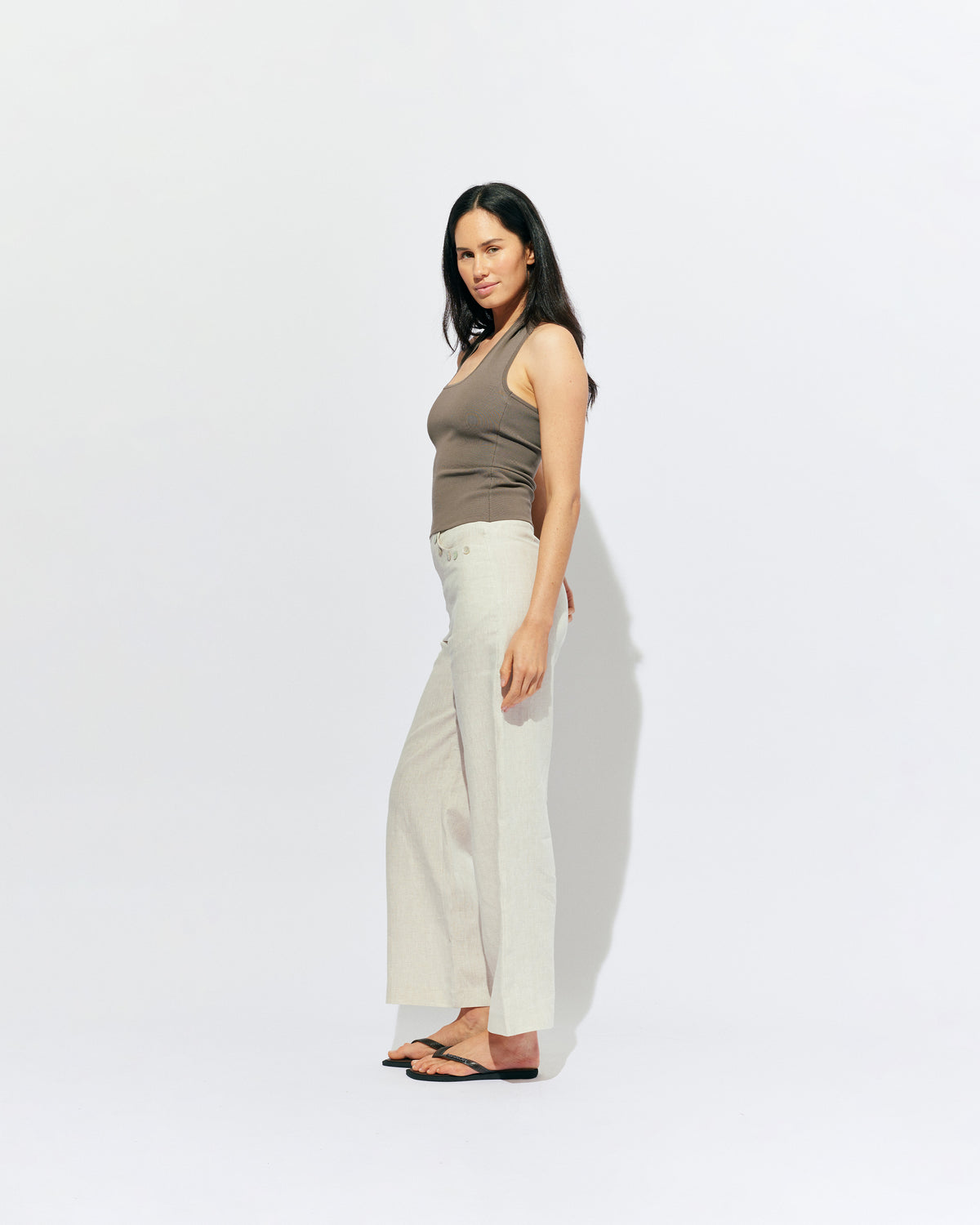 CAROLYN LINEN PANT NATURAL | Classic high waisted linen pant with an elevated twist ~ straight leg silhouette, designed in a lightweight natural linen and with feature shell buttons along the pockets. Pair it with our Carolyn Vest for the ultimate power suit moment in your...