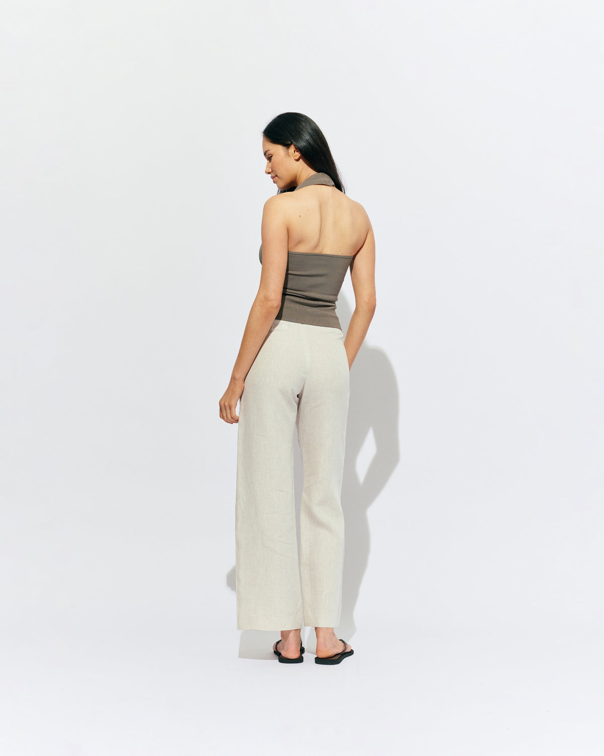 RUDI TANK STONE | A twist on the classic halter tank with an oversized strap designed to sit gathered around the neckline, crafted in a mid-weight stone knit. This tank is designed to be worn tight and hold you in when worn. Pair with...