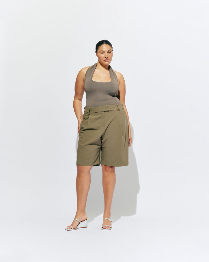 COCO SUIT SHORT MARTINI OLIVE | Classic suiting short designed in a midweight martini olive green, featuring front pleats, pockets and a wide leg. Make it a matching set with our Coco Short Sleeve Blazer or Carolyn Short Sleeve Blazer.