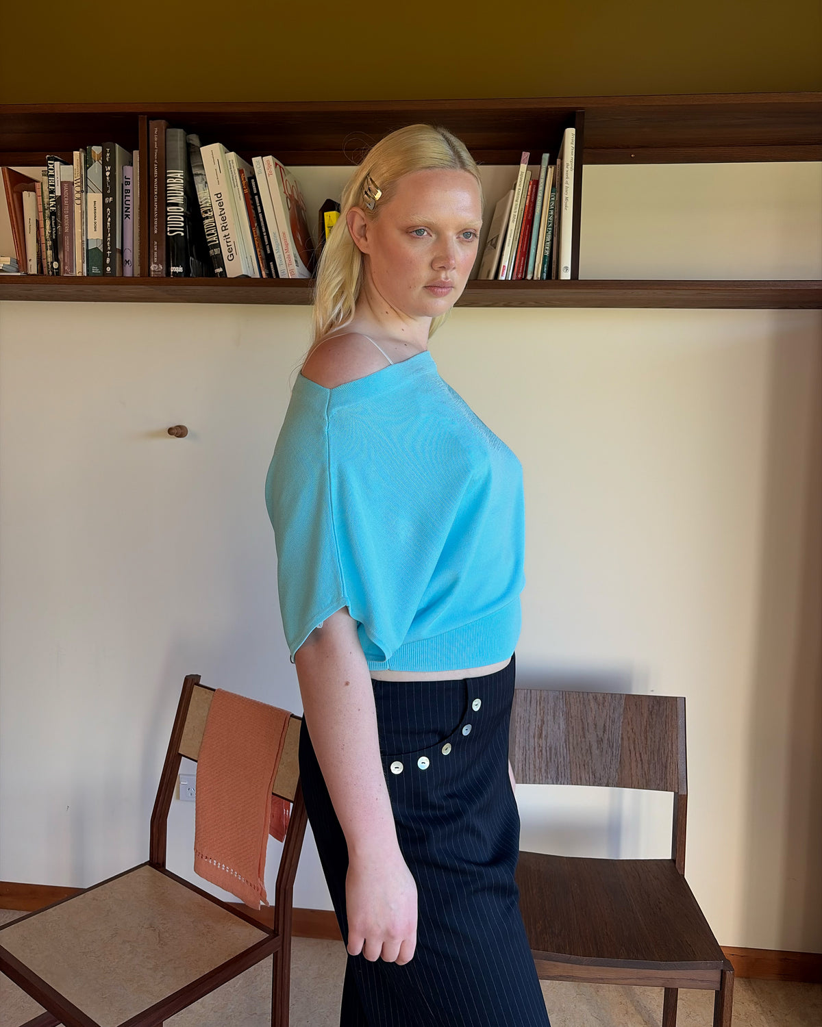 BODE BATWING SHORT SLEEVE TOP AQUA | Off-shoulder batwing short sleeve top crafted in a mid-weight aqua knit. This top is simple yet elevated and can be worn on or off the shoulder. Pair it with denim for a chic everyday look.
