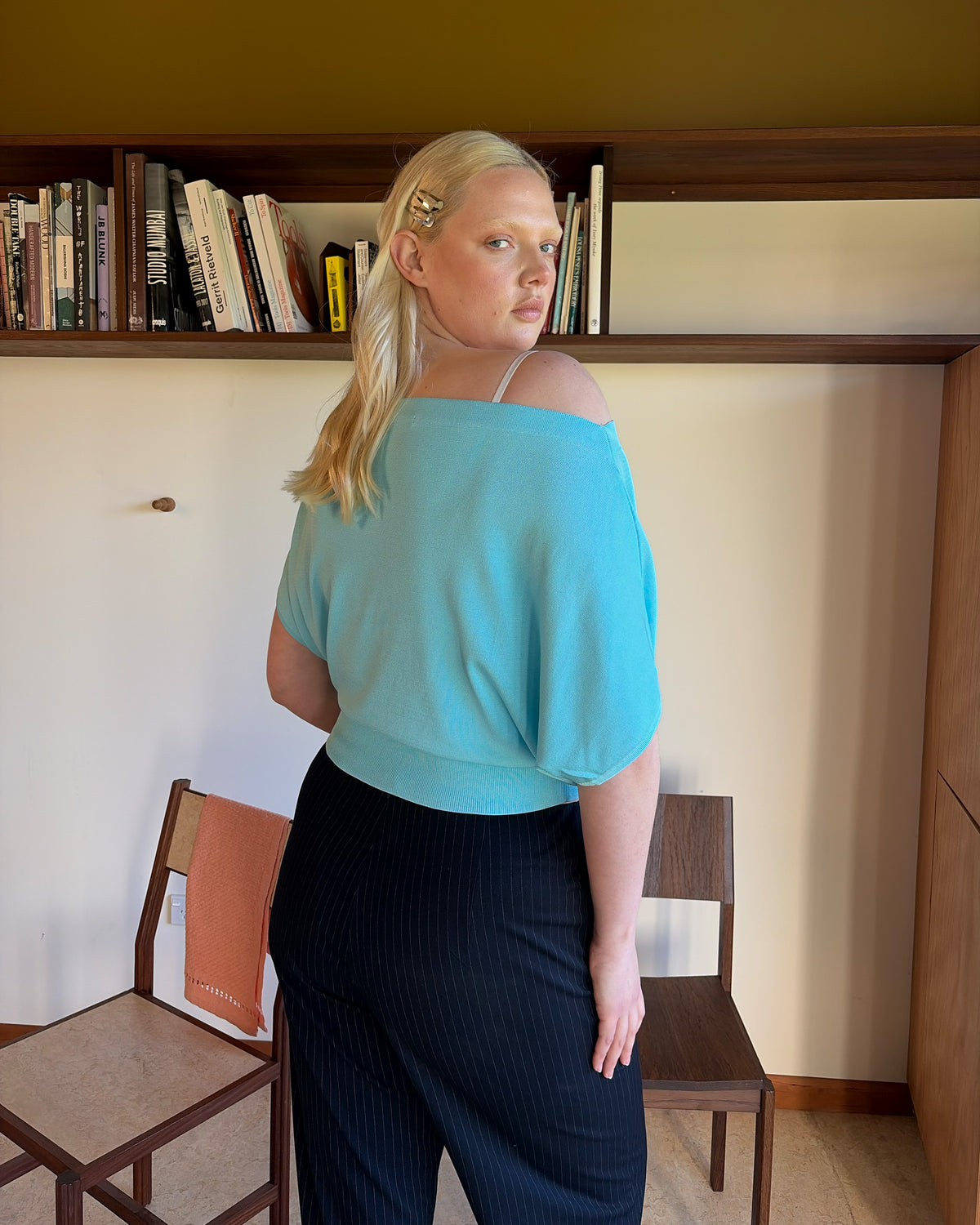 BODE BATWING SHORT SLEEVE TOP AQUA | Off-shoulder batwing short sleeve top crafted in a mid-weight aqua knit. This top is simple yet elevated and can be worn on or off the shoulder. Pair it with denim for a chic everyday look.