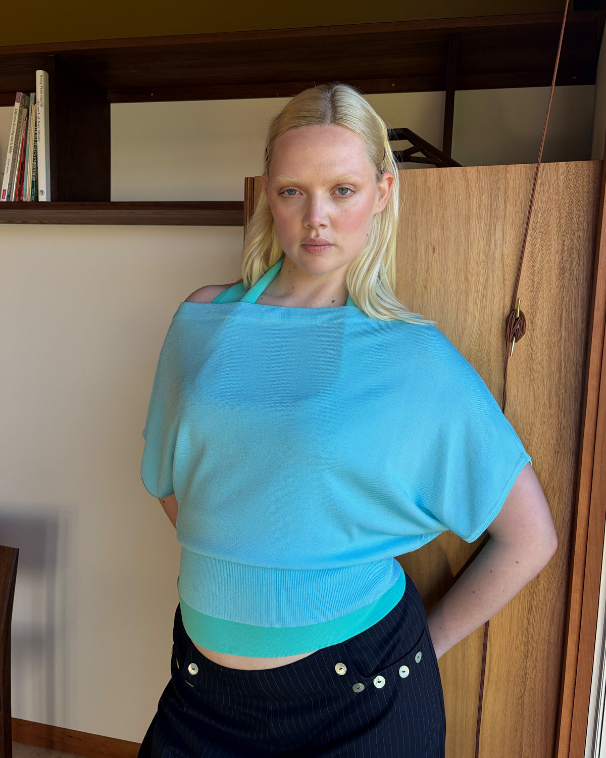 BODE BATWING SHORT SLEEVE TOP AQUA | Off-shoulder batwing short sleeve top crafted in a mid-weight aqua knit. This top is simple yet elevated and can be worn on or off the shoulder. Pair it with denim for a chic everyday look.