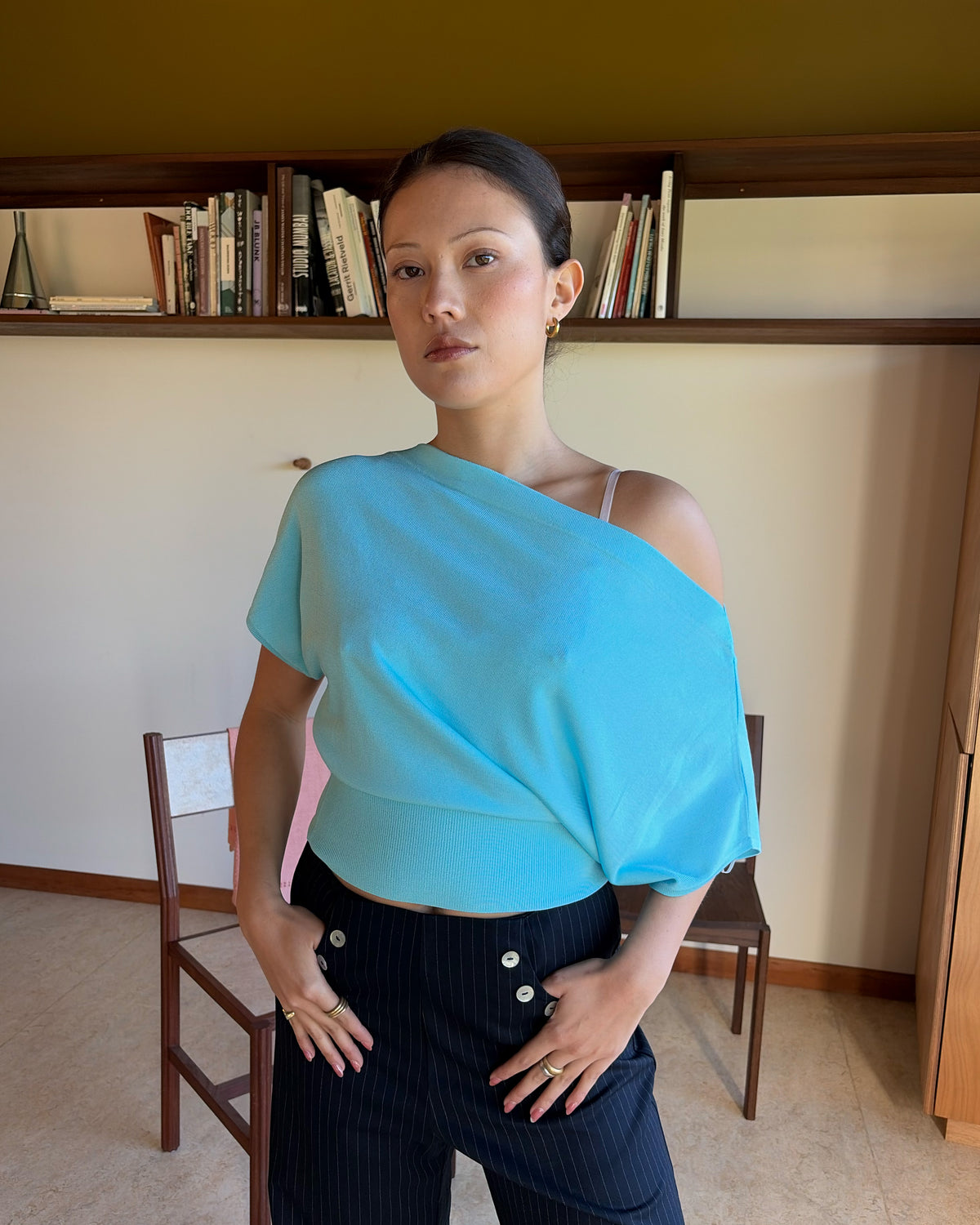 BODE BATWING SHORT SLEEVE TOP AQUA | Off-shoulder batwing short sleeve top crafted in a mid-weight aqua knit. This top is simple yet elevated and can be worn on or off the shoulder. Pair it with denim for a chic everyday look.