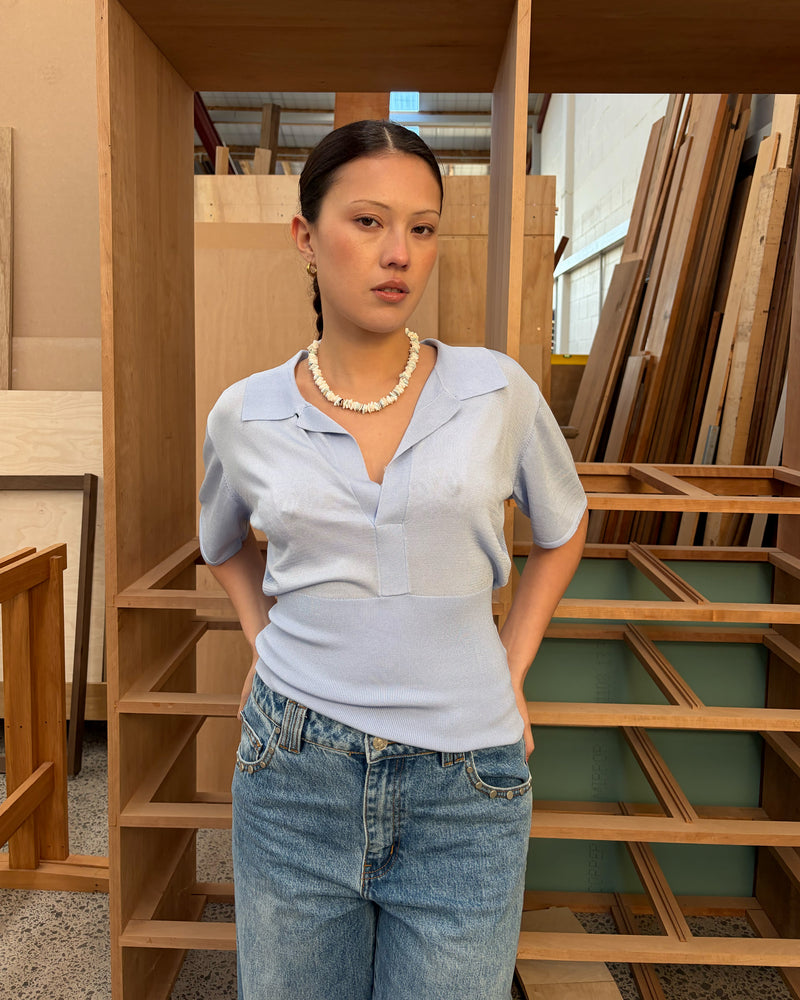RAMONA SHORT SLEEVE POLO TOP SERENITY | An update to our Ramona Polo Top, this short sleeve knit is designed in our dreamy serenity blue, featuring a collar and wide V-neckline. Paired with denim or your favourite skirt, this top is a staple for your everyday wardrobe.