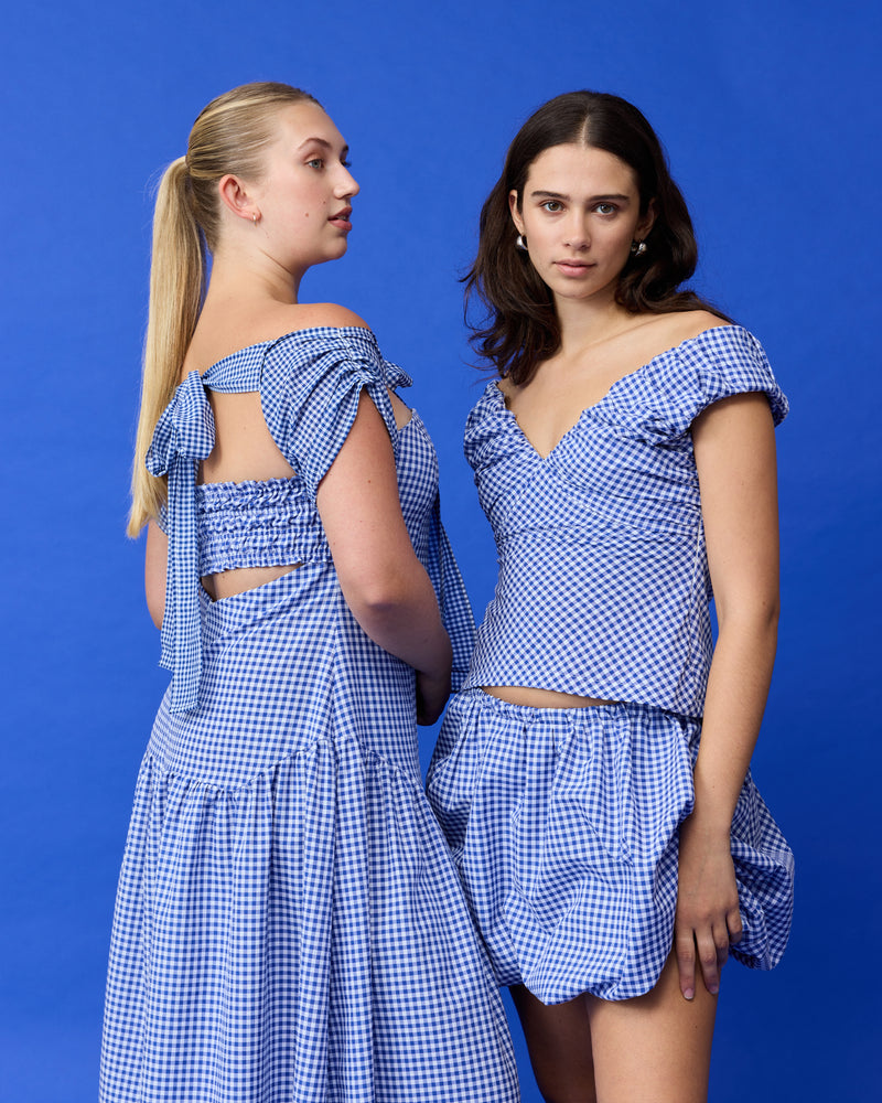 RUBY X EMMA JING PLEATED SLEEVES COBALT GINGHAM | Pleated sleeves featured as part of Summer Fling with Emma Jing, our Holiday 2024 collaboration with local Aotearoa designer, Emma Jing. A fun layering piece to add to your wardrobe.