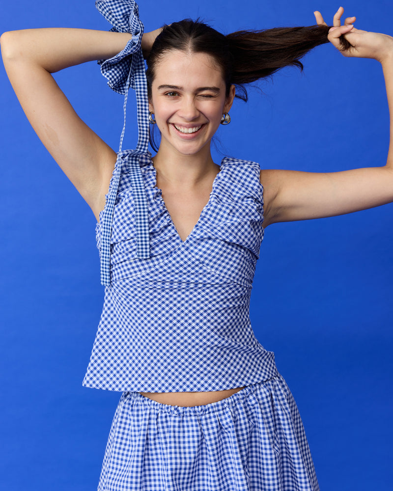 RAQUEL TOP COBALT GINGHAM | Crafted in a cobalt gingham fabric with ruched detailing at the bust, this top can be worn on or off the shoulder. The tailored fit is designed to sit close...