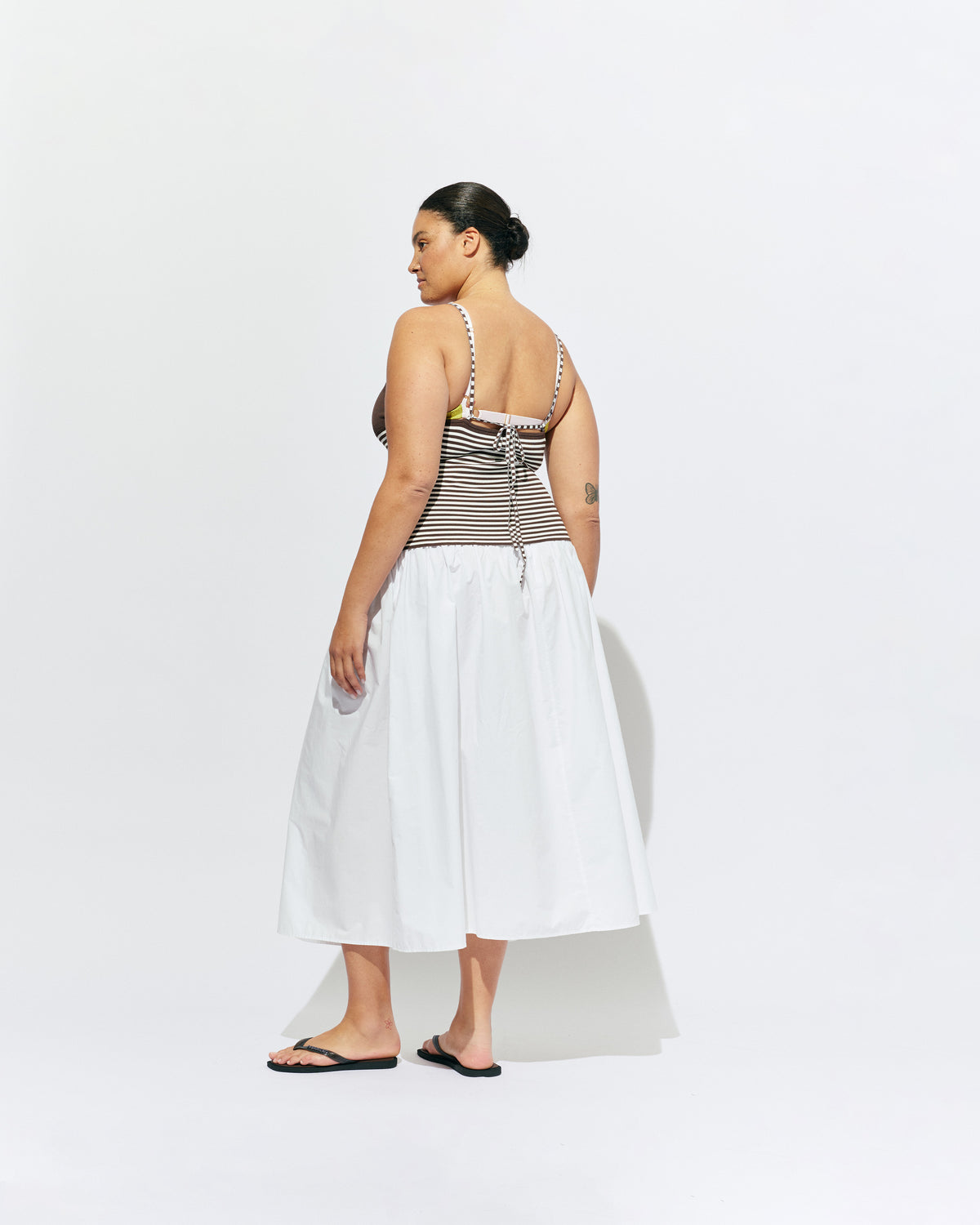 TOFFEE TANK BROWN STRIPE | Lightweight tank top designed in a brown and white striped knit. This tank features long ties which can be worn multiple ways, from a cross over back to a halter, and is the perfect throw-on top for the summer season. 