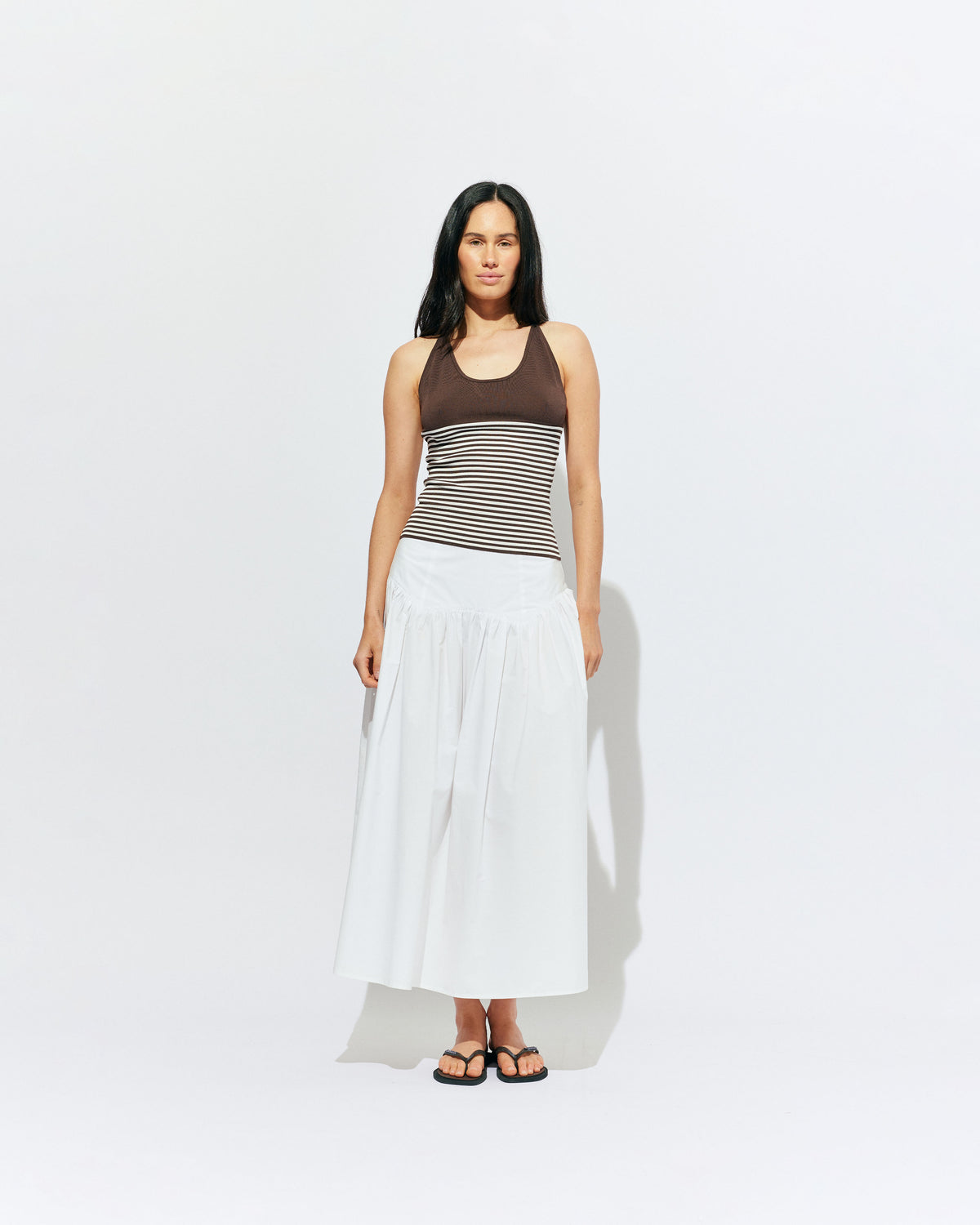 TOFFEE TANK BROWN STRIPE | Lightweight tank top designed in a brown and white striped knit. This tank features long ties which can be worn multiple ways, from a cross over back to a halter, and is the perfect throw-on top for the summer season. 