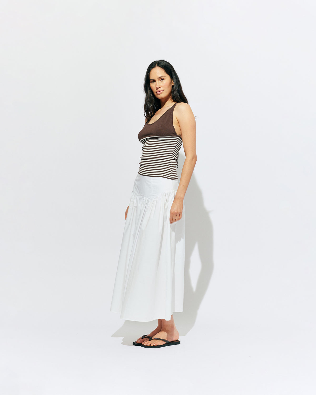 TOFFEE TANK BROWN STRIPE | Lightweight tank top designed in a brown and white striped knit. This tank features long ties which can be worn multiple ways, from a cross over back to a halter, and is the perfect throw-on top for the summer season. 