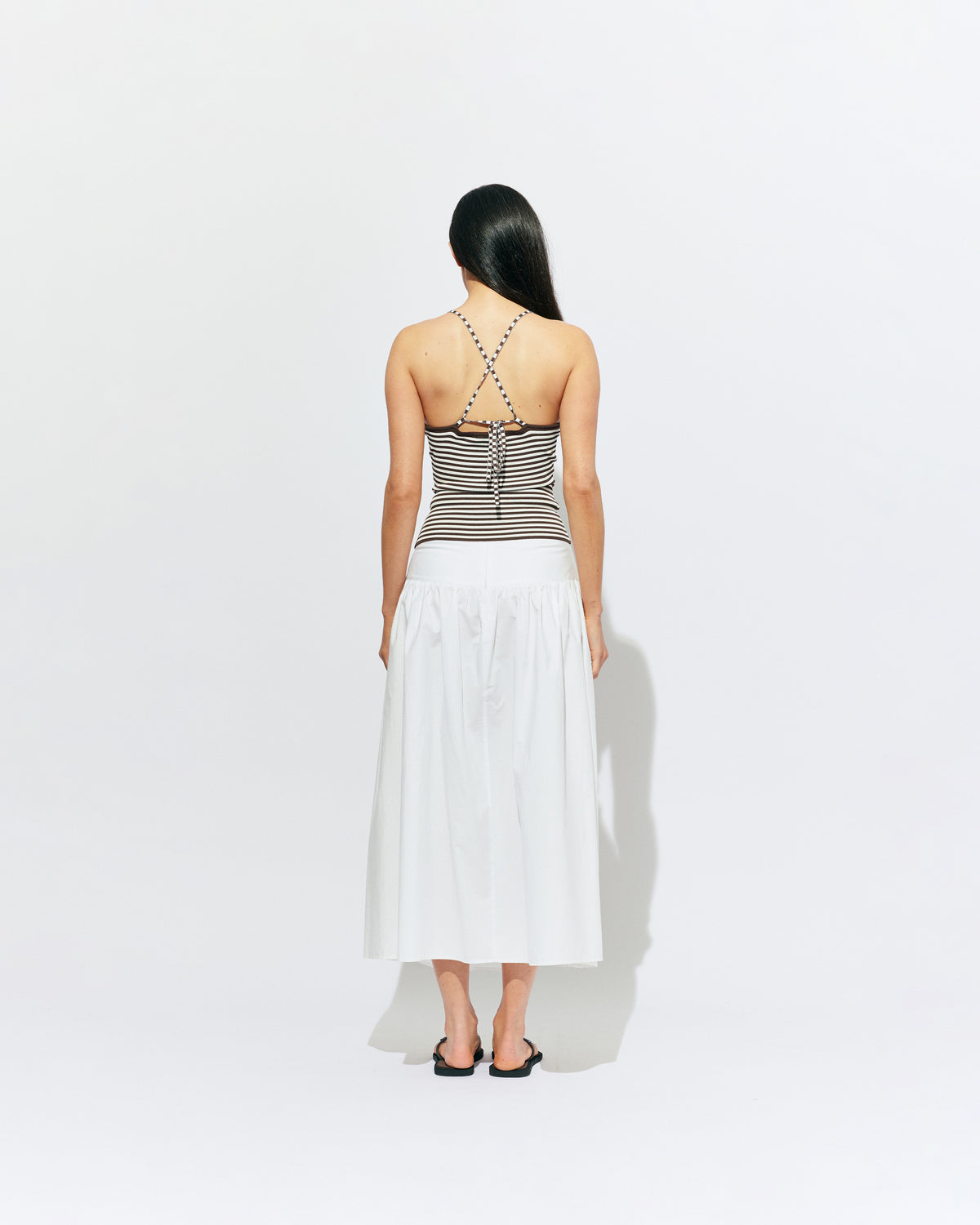 TOFFEE TANK BROWN STRIPE | Lightweight tank top designed in a brown and white striped knit. This tank features long ties which can be worn multiple ways, from a cross over back to a halter, and is the perfect throw-on top for the summer season. 