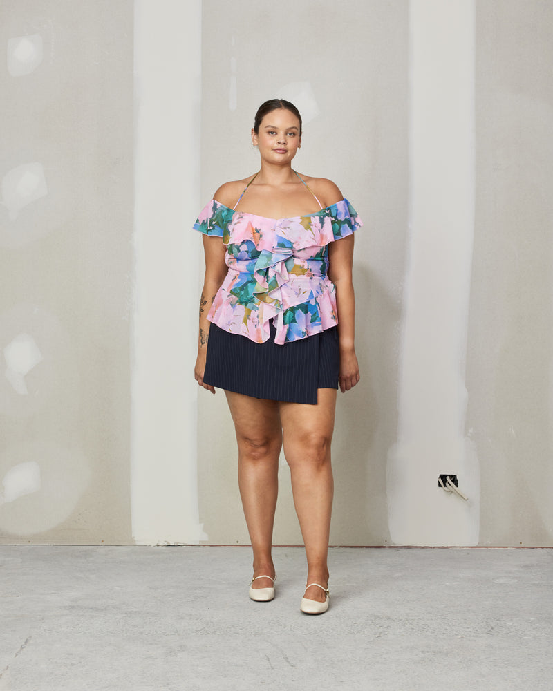 SENSE RUFFLE TOP DREAM FLORAL | Off shoulder chiffon blouse with a halter tie strap and self covered buttons down the centre in our dream floral print. The ruffle detailing along with the print gives this blouse...