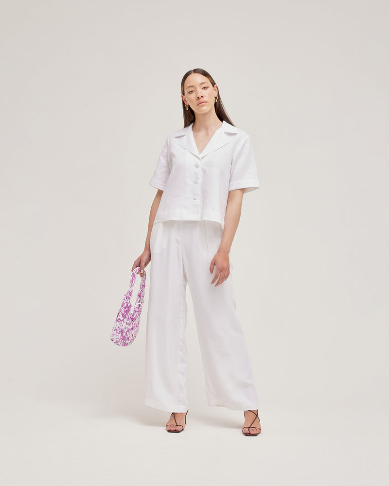  SESAME SHIRT WHITE | Oversized boxy linen shirt with a slight A-line shape, notch lapel collar and feature self-covered buttons. This shirt can be worn as a soft layering piece as well as a...