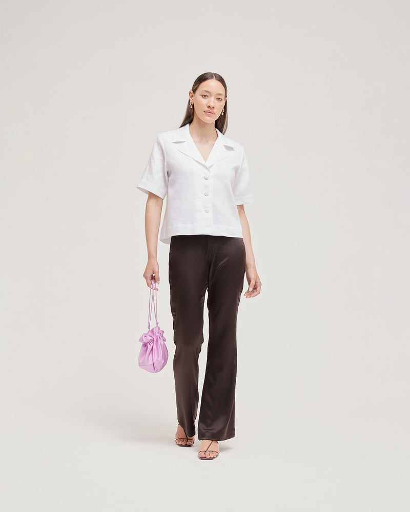 POPPY PANT ESPRESSO | Highwaisted pant that sits snug at the waist, hip and thigh and falls to a subtle flare designed in a sheeny espresso coloured satin. These pants are timeless and tailored...