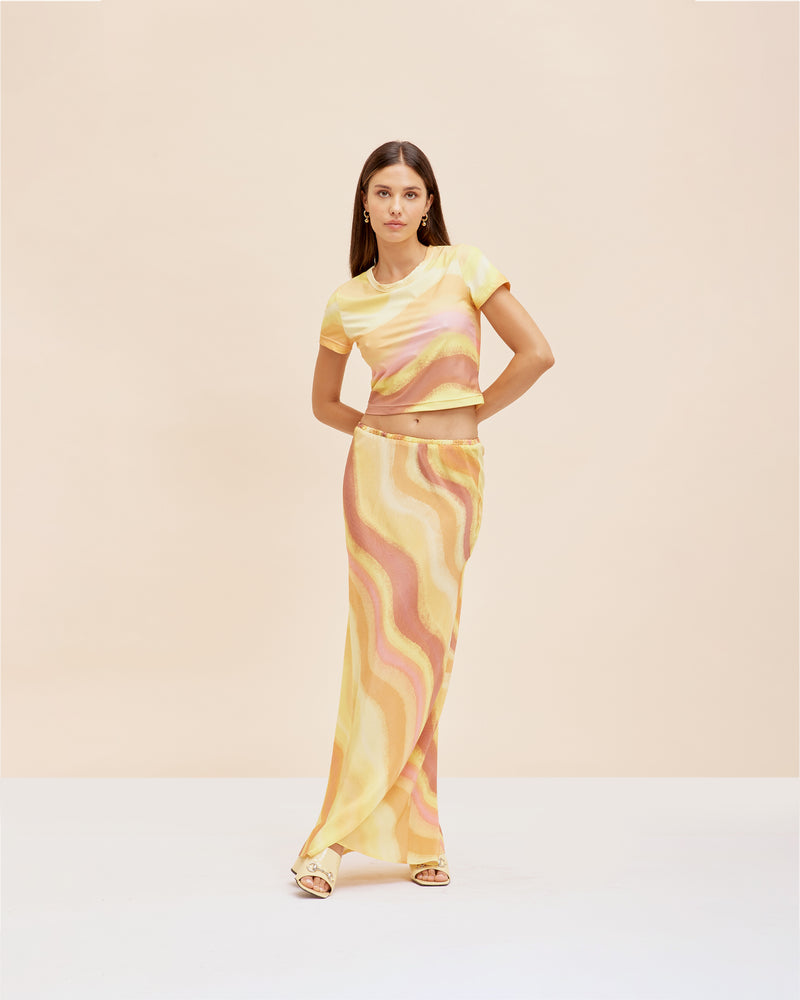 SOLAR SILK SKIRT SOLAR PRINT | Bias cut straight skirt designed in our sunset print. Features an elastic waistband so you can wear this skirt as low or as high as you like.