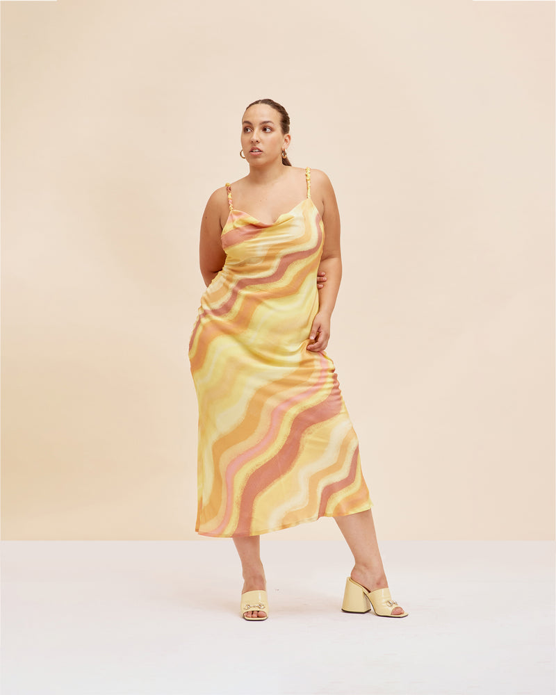 SOLAR SILK SLIP SOLAR PRINT | Bias cut cowl neck silk slip dress designed in our sunset print. Features scrunch style straps that fall to reveal a low back.