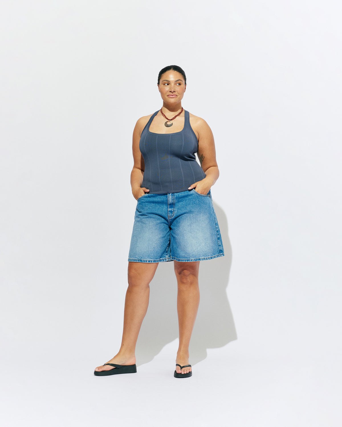 SOL TANK BLUE SLATE | A wardrobe staple for all year round, this classic racerback tank top is designed in a mid-weight blue slate knit. Wear as a base layer in cooler weather, or as an everyday go to during the warmer months. 