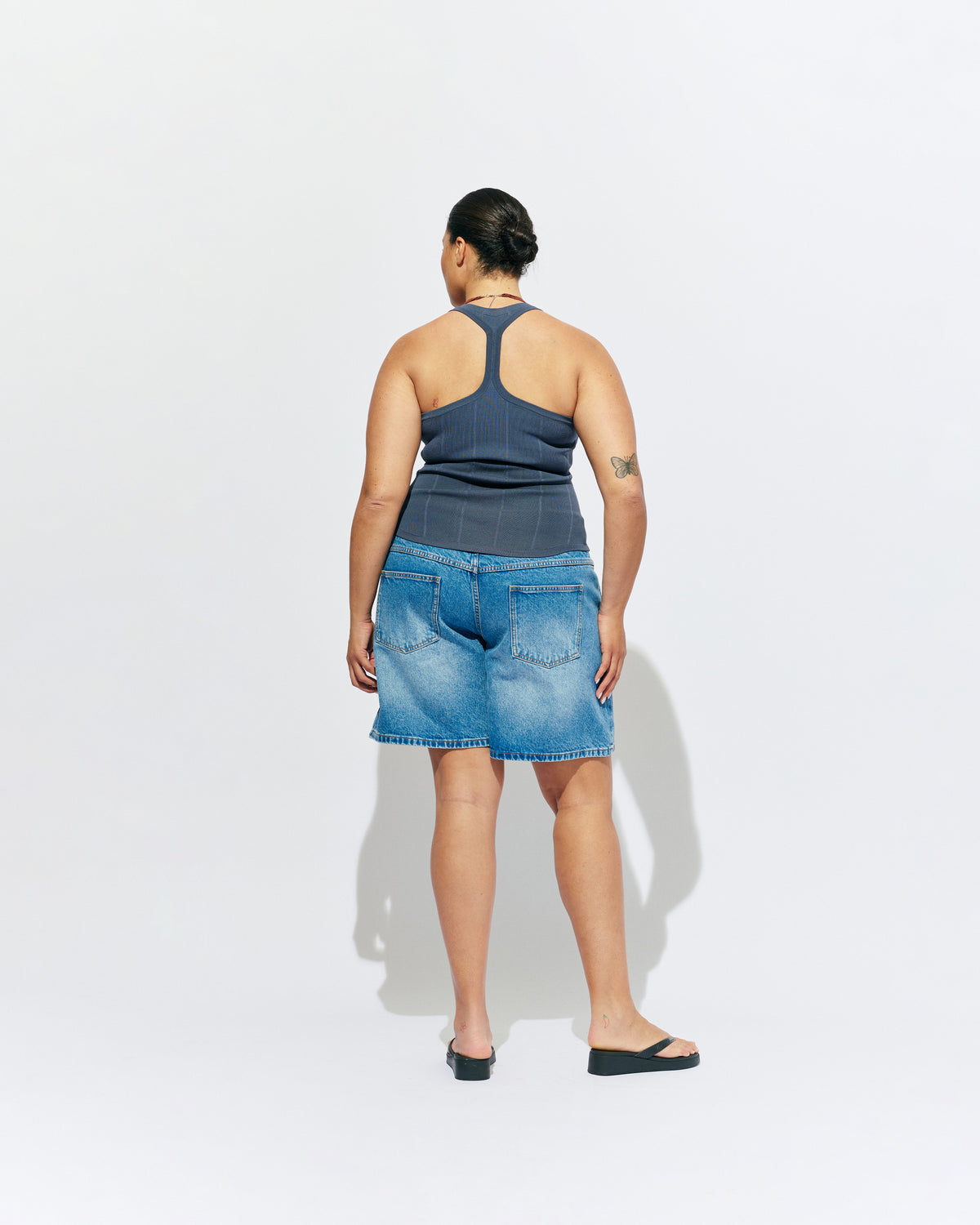 SOL TANK BLUE SLATE | A wardrobe staple for all year round, this classic racerback tank top is designed in a mid-weight blue slate knit. Wear as a base layer in cooler weather, or as an everyday go to during the warmer months. 