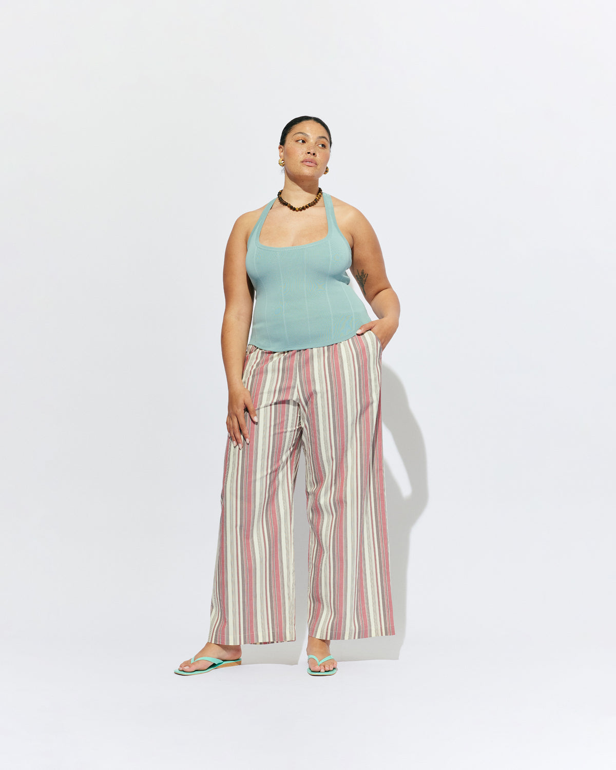 SOL TANK SEAFOAM | A wardrobe staple for all year round, this classic racerback tank top is designed in a mid-weight seafoam knit. Wear as a base layer in cooler weather, or as an everyday go to during the warmer months. 