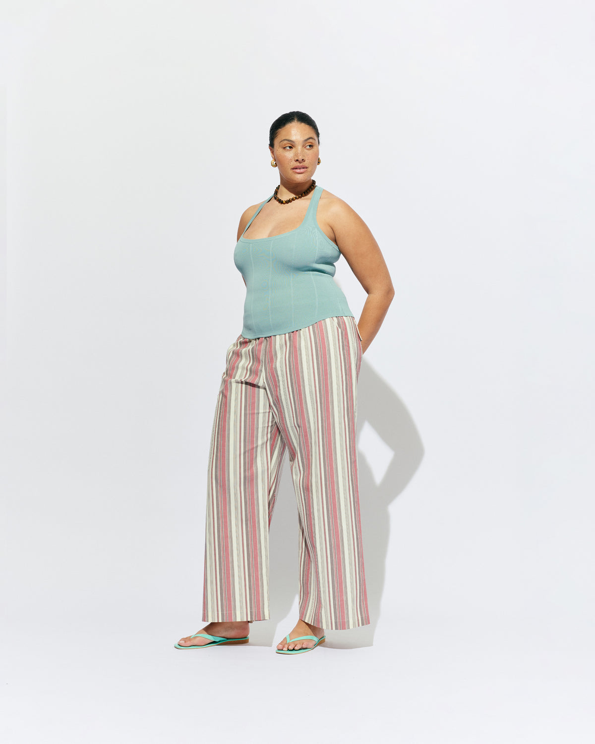SOL TANK SEAFOAM | A wardrobe staple for all year round, this classic racerback tank top is designed in a mid-weight seafoam knit. Wear as a base layer in cooler weather, or as an everyday go to during the warmer months. 