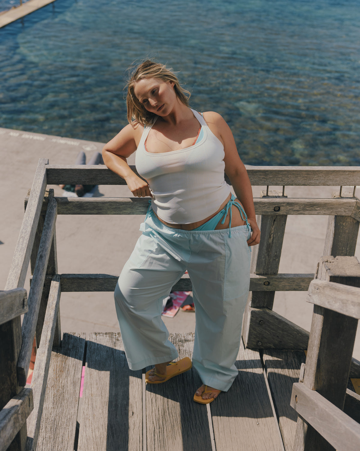 SOL TANK WHITE | A wardrobe staple for all year round, this classic racerback tank top is designed in a mid-weight white knit. Wear as a base layer under your winter favourites, or as an everyday go to during the warmer months. 