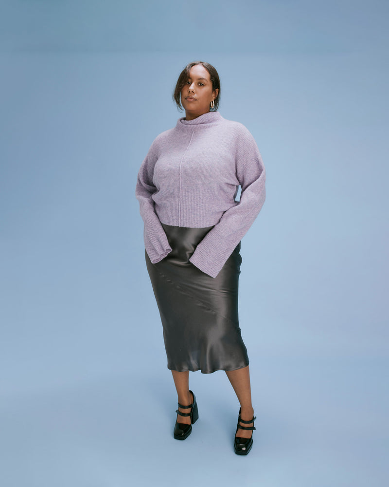 SUZIE TURTLENECK WISTERIA | Turtleneck knit sweater spun in a ribbed handle that is loosely draped. With a front seam detail, this sweater has a relaxed fit and the chunky neckline looks good standing...