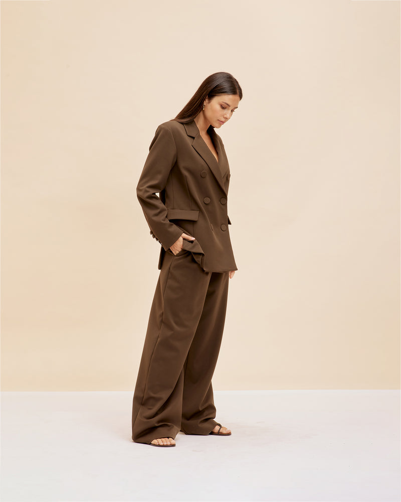 SWEENEY TROUSER OLIVE | High waisted, relaxed suit trouser in a rich olive shade. Beautifully tailored pants with neatly pressed pleats that highlight the shape.