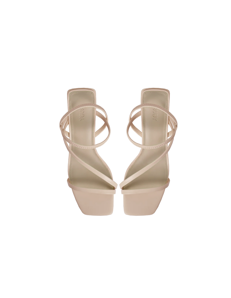 TIA HEEL BEIGE | Square toe heel with straps around the ankle and across the front of the foot. A square block heel adds height but makes these shoes sturdy, while the ankle strap...