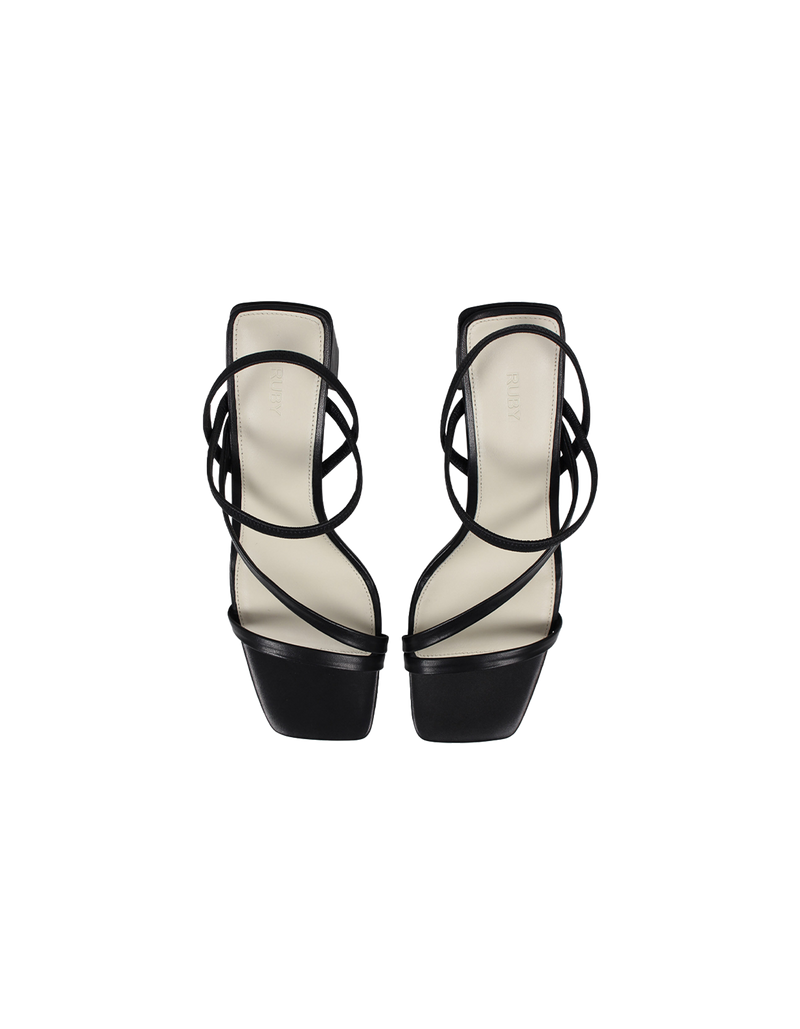  TIA HEEL BLACK | Square toe heel with straps around the ankle and across the front of the foot. A square block heel adds height but makes these shoes sturdy, while the ankle strap...