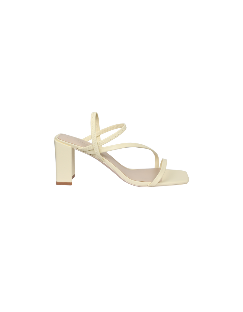 TIA HEEL BUTTER | Square toe heel with straps around the ankle and across the front of the foot. A square block heel adds height but makes these shoes sturdy, while the ankle strap...