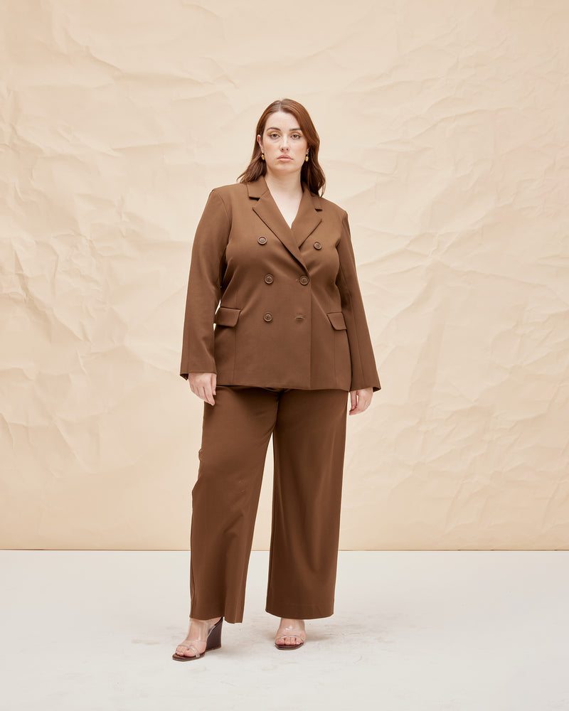 TONY BLAZER BRONZE | Relaxed, double breasted blazer with a boxy shape, in a rich bronze shade. Designed for a loose fit with notched lapels and slightly structured shoulders, this piece is both modern and...