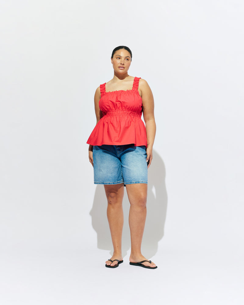 TRULLI TOP CHERRY | Sleeveless cotton top with a square neckline, designed in our cherry red organic cotton. This top falls to a full A-line shape and has shirring through the bust and straps for an accommodating fit. Make it a matching set with our...