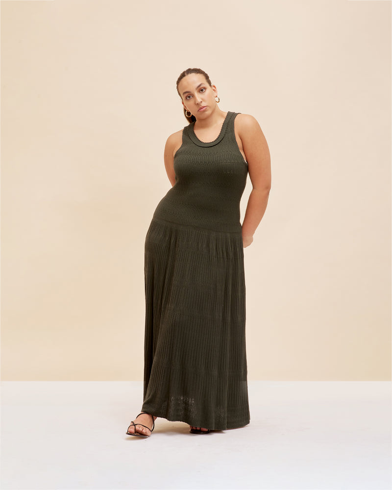 VANYA DRESS KHAKI | Braided knit dress designed in a soft mid-weight yarn with a plush handfeel. Designed in a rich forest green colour, this dress has a feature rib detail at the neckline...