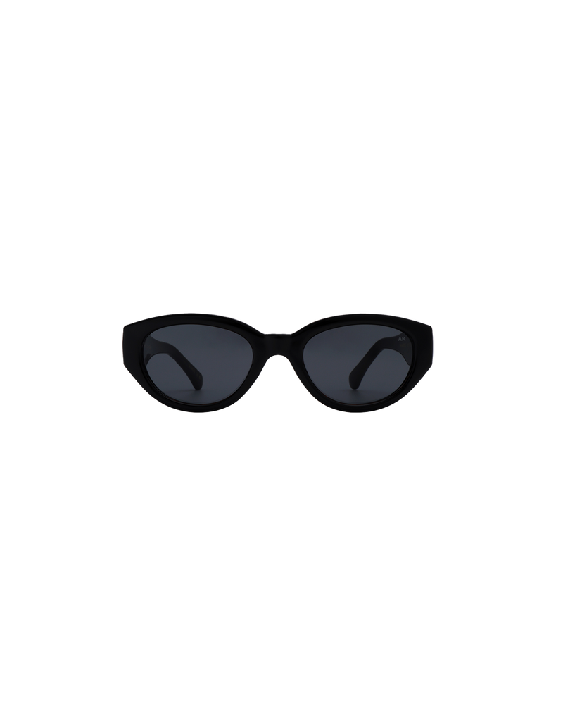 WINNIE SUNGLASS BLACK | The Winnie by A.Kjaerbede is a futuristic cat eye sunglass with black frames and black tinted lens.